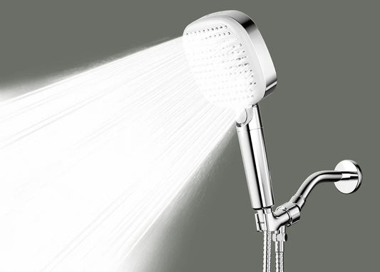 The LiberaQuar S-1 handheld shower head showing its broad Rain spray pattern.